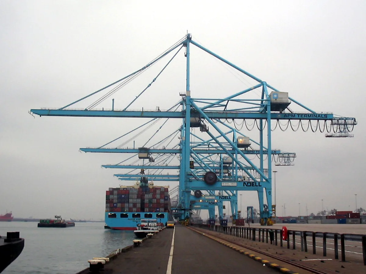 Port gantry cranes and a container vessel at berth